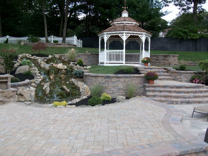 backyard retaining walls and steps with waterfall
